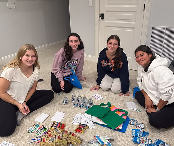 Volunteers assembling care bags
