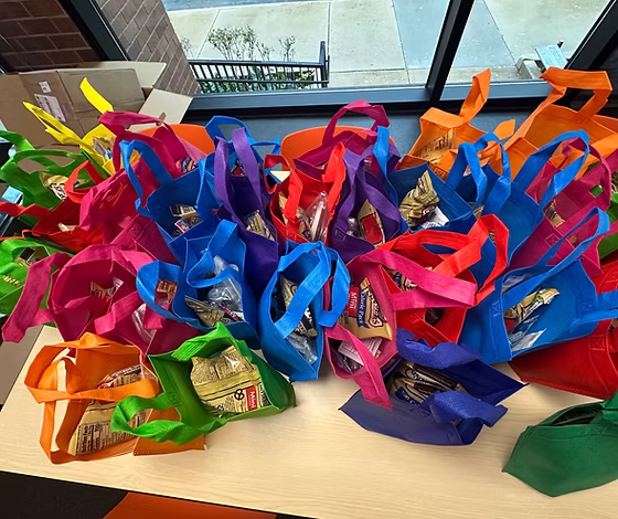 Colorful care bags packed with supplies